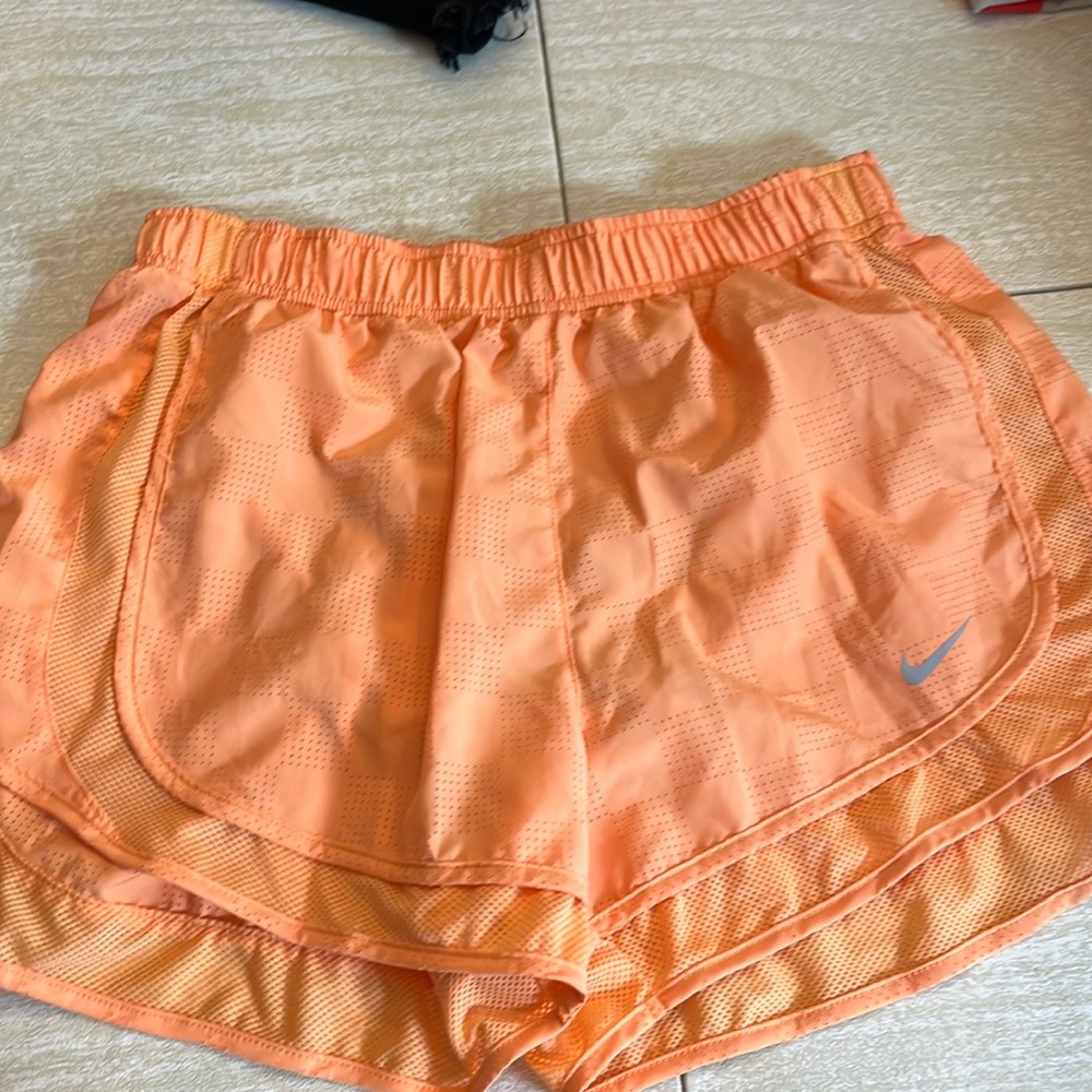 Orange Nike athletic shorts
